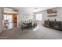 Formal dining area with stylish furnishings and a view into the kitchen at 12513 W Dreyfus Dr, El Mirage, AZ 85335