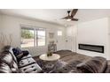 Inviting living room features modern fireplace, ceiling fan, and ample natural light at 1539 W 5Th St, Tempe, AZ 85281