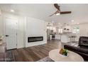 Open-concept living room with a modern fireplace seamlessly connects to the kitchen at 1539 W 5Th St, Tempe, AZ 85281