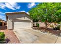 Single-Gathering house with a two-car garage and low-maintenance landscaping at 16848 W Rimrock St, Surprise, AZ 85388
