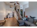 Open living room with tile floors, high ceilings, and staircase leading to the second floor at 1718 S Longmore -- # 95, Mesa, AZ 85202