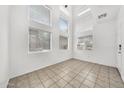 Bright and airy living room with floor-to-ceiling windows and tile flooring for easy maintenance at 1718 W Colter St # 195, Phoenix, AZ 85015