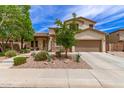 Charming two-story home with well-maintained landscaping and an attached two-car garage at 42711 N 45Th Dr, Phoenix, AZ 85087