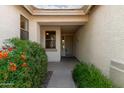 Inviting home entrance with desert landscaping, a covered porch, and a glimpse of the front door at 4335 E Sleighbell Dr, Gilbert, AZ 85297