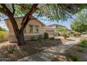 A well-maintained single-Gathering home featuring desert landscaping, a two-car garage, and a cozy neighborhood ambiance at 4335 E Sleighbell Dr, Gilbert, AZ 85297