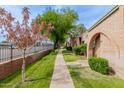 Beautiful community featuring brick exteriors, lush green lawns, and well-manicured landscaping at 4401 E Hubbell St # 57, Phoenix, AZ 85008