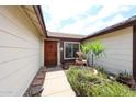 Welcoming front entrance with a decorative fountain and lush greenery at 6313 W Paradise Ln, Glendale, AZ 85306