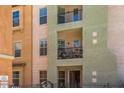Exterior view of a balcony with furniture on a multi-story home under a clear sky at 14575 W Mountain View Blvd # 11212, Surprise, AZ 85374