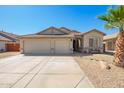 Inviting single-story home with a well-maintained desert-style yard and a convenient two-car garage at 16817 W Bradford Way, Surprise, AZ 85374