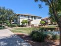 Inviting townhome with charming landscaping and lake view, set in a peaceful community at 1814 E Bridgeport Pkwy # 103, Gilbert, AZ 85295