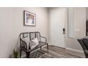 Welcoming entryway features wood-look flooring, bench seating, and tasteful wall decor at 2024 E Cherry Hills Pl, Chandler, AZ 85249