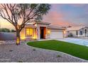 Aesthetic home featuring desert landscaping, a trimmed lawn, and a convenient two-car garage at 2024 E Cherry Hills Pl, Chandler, AZ 85249