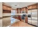 Gourmet kitchen featuring granite countertops and stainless steel appliances at 2994 E Megan St, Gilbert, AZ 85295
