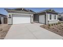 Wide driveway leads to a two-car garage, enhancing the home's curb appeal at 35524 N Tin Ct, San Tan Valley, AZ 85144