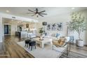 Inviting living room is open to the kitchen and features stylish decor, comfortable seating, and lots of light at 36601 N Mule Train Rd # D1, Carefree, AZ 85377