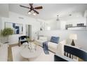 Bright open-concept living room with views of the kitchen and stairs at 3755 E Broadway Rd # 21, Mesa, AZ 85206