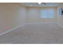 Cozy bedroom featuring plush carpeting, a ceiling fan, neutral walls and a tv at 4132 E Sweetwater Ave, Phoenix, AZ 85032