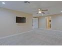 Spacious bedroom featuring a ceiling fan, plush carpeting, and ample natural light at 4132 E Sweetwater Ave, Phoenix, AZ 85032