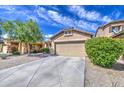 Single-story home showcasing desert landscaping, driveway and appealing exterior at 5342 W Maldonado Rd, Laveen, AZ 85339