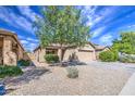 Inviting single-story residence showcasing desert landscaping, and a welcoming exterior at 5342 W Maldonado Rd, Laveen, AZ 85339