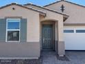 Charming single-story home featuring a two-car garage and professionally landscaped front yard at 5537 S 246Th Ave, Buckeye, AZ 85326