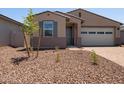 Well-maintained front yard with desert landscaping and a charming single-story home at 5537 S 246Th Ave, Buckeye, AZ 85326