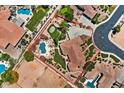 Aerial view of property showing perimeter, resort style pool, putting green, and lush landscape at 5755 S Pearl Dr, Chandler, AZ 85249