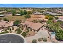 Beautiful single-story home with lush landscaping, manicured lawn and circular driveway at 5755 S Pearl Dr, Chandler, AZ 85249