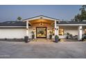 Elegant home exterior featuring a grand entrance with manicured landscaping and stylish lighting at 7100 N 47Th St, Paradise Valley, AZ 85253