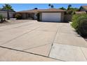 Charming single story home featuring a spacious driveway with a two car garage at 909 W Mesquite St, Chandler, AZ 85225