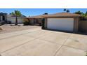 Charming single story home featuring a spacious driveway with a two car garage at 909 W Mesquite St, Chandler, AZ 85225