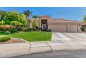 Charming single-story home featuring a three-car garage, mature landscaping, and inviting curb appeal at 9571 N 117Th St, Scottsdale, AZ 85259