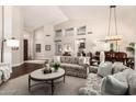 Bright and open living space featuring soaring ceilings, abundant natural light, and elegant decor at 9571 N 117Th St, Scottsdale, AZ 85259