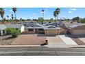 Single-story home with desert landscaping, set in a well-maintained neighborhood with palm trees at 1511 W Mesquite St, Chandler, AZ 85224