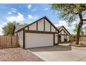 Exterior of a well-maintained home featuring a two-car garage and gravel landscaping at 20626 N 5Th Ave, Phoenix, AZ 85027