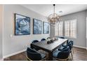 Dining room showcases stylish lighting and modern artwork, seating for eight at 214 W Beverly Ln, Phoenix, AZ 85023