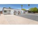 Stylish single-story home featuring a covered carport, xeriscaped yard, and modern design at 2320 E Mulberry Dr, Phoenix, AZ 85016