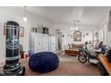 Living room with wall decorations, furniture, and a blue beanbag at 3418 W Maldonado Rd, Phoenix, AZ 85041