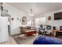 Bright living room with neutral paint, tile floors, and large windows at 3418 W Maldonado Rd, Phoenix, AZ 85041