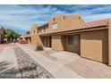 Townhome complex with landscaped common areas and well-maintained exteriors at 3511 E Baseline Rd # 1085, Phoenix, AZ 85042