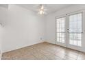 Bright room featuring tile flooring and patio doors for natural light at 3511 E Baseline Rd # 1085, Phoenix, AZ 85042
