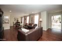 Spacious living room with hardwood floors, stylish furniture, and plenty of natural light at 4010 E Catalina Dr, Phoenix, AZ 85018