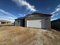 Newly constructed single-Gathering home showing gray stucco and a white garage door at 4345 E Brook Lynn Pl, San Tan Valley, AZ 85143