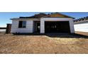 Exterior view of a home under construction with a garage and window at 4345 E Brook Lynn Pl, San Tan Valley, AZ 85143