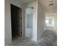 Bright hallway featuring white walls and trim, leading to various rooms in the new house at 4345 E Brook Lynn Pl, San Tan Valley, AZ 85143