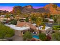 Gorgeous aerial view of home, landscaping, and mountain views in the surrounding area at 4450 E Camelback Rd # 4, Phoenix, AZ 85018
