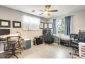 Bright bedroom with a ceiling fan, neutral walls, light wood floors and natural light from the window at 534 W 15Th St, Tempe, AZ 85281