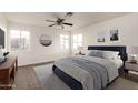 Comfortable bedroom with a ceiling fan, plush rug, ample natural light, and stylish decor at 6873 E Kathleen Rd, Scottsdale, AZ 85254