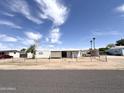 Mobile home with chain link fence and a carport at 6950 W Karen Lee Ln, Peoria, AZ 85382