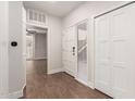 Bright entryway featuring tile flooring, closet, and door to the main living area at 7700 E Gainey Ranch Rd # 102, Scottsdale, AZ 85258